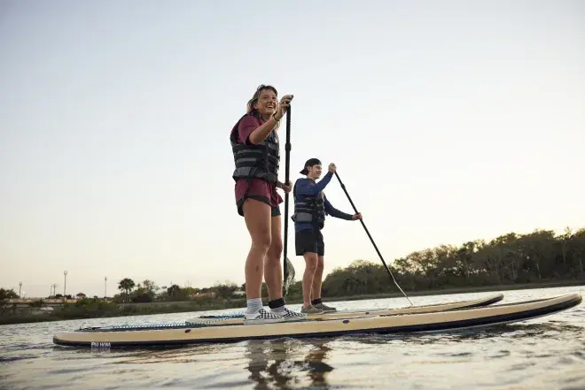 Two students on Paddle boards 