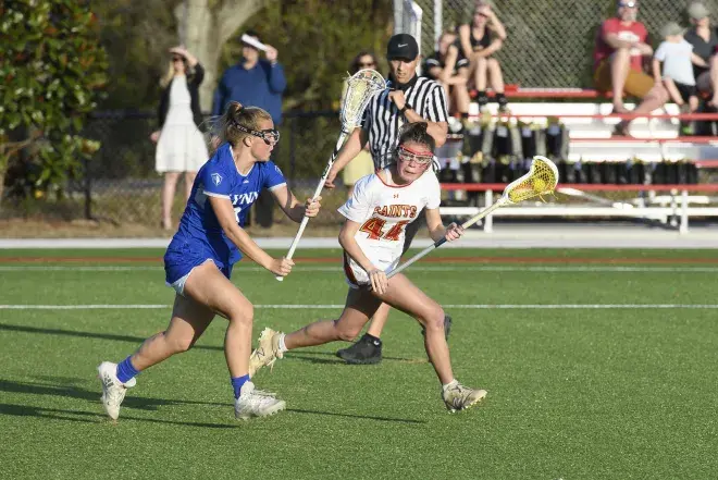 Flagler Lacrosse players fighting for the ball