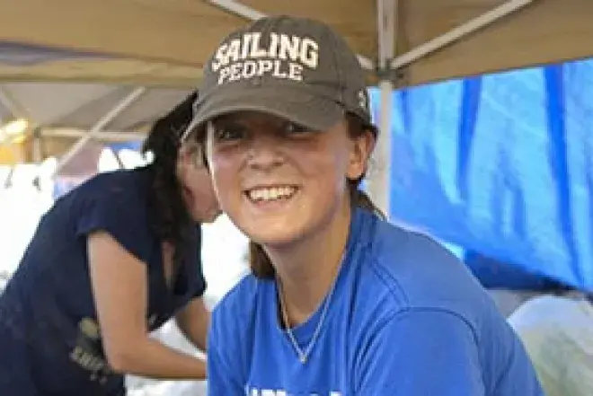 A student smiles.