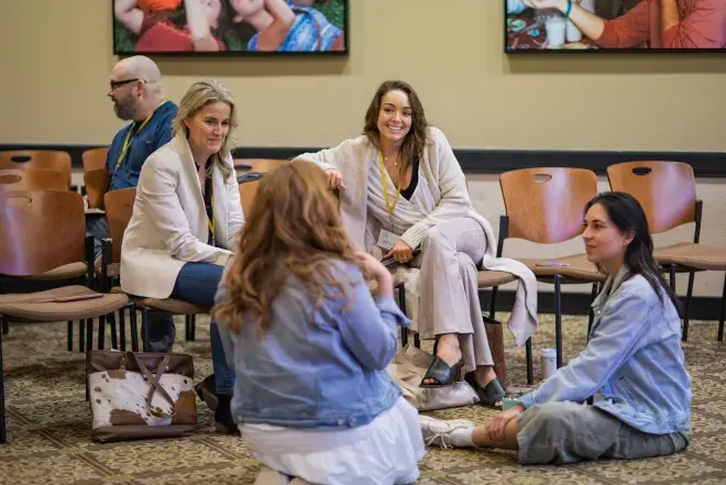 A group of people chats.