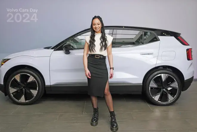 Hunter Roque standing in front of Volvo car