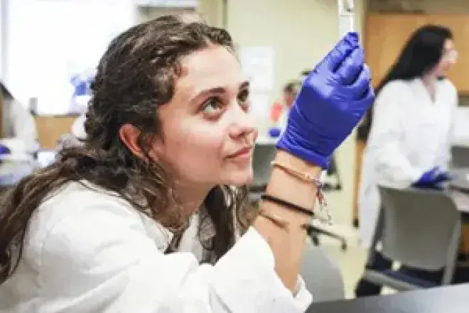 Photo of Biology Student Holding Test Tube