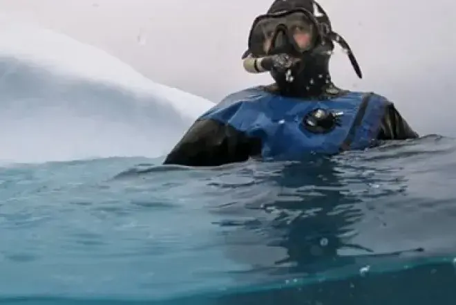 Photo of Claire Mortensen scuba diving in the ocean
