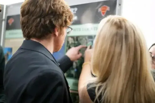 Image of students looking at information