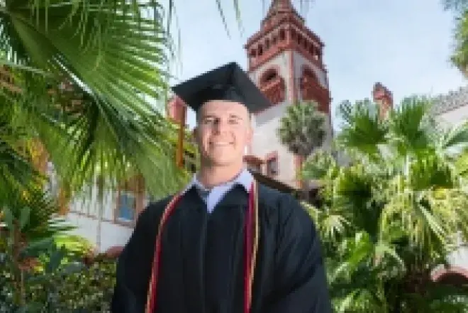 Graduate Student in Cap and Gown