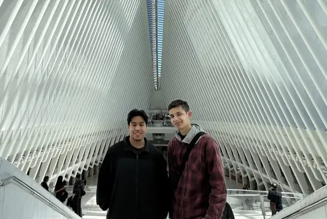 Students posing for photo in building