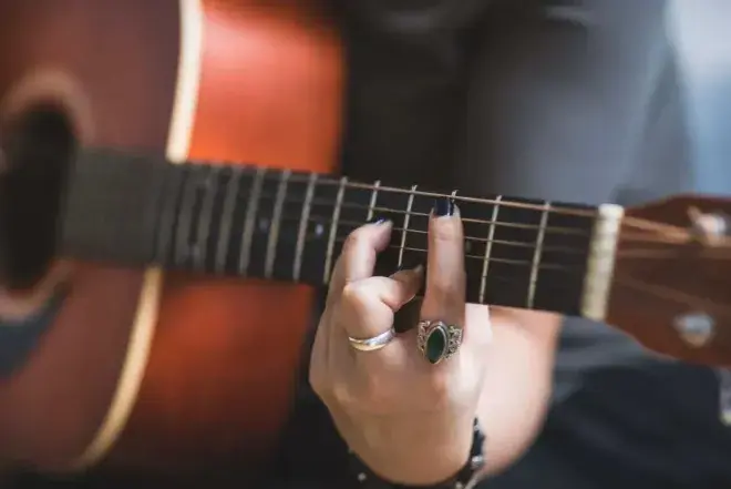 Person playing guitar