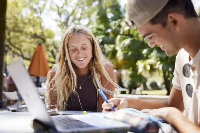 Students working on classwork outside