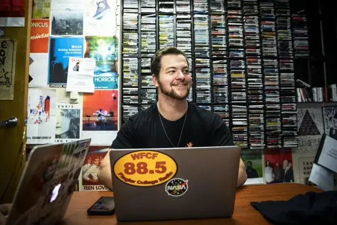 Student on laptop in record room