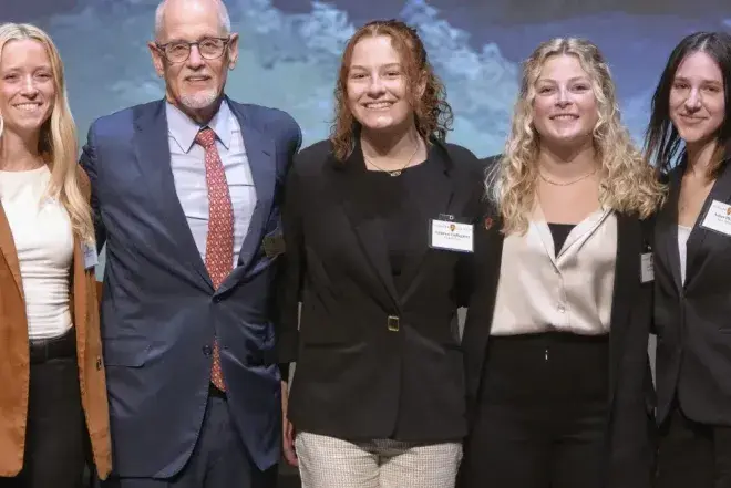 Students and professor at Lion's Cage competition