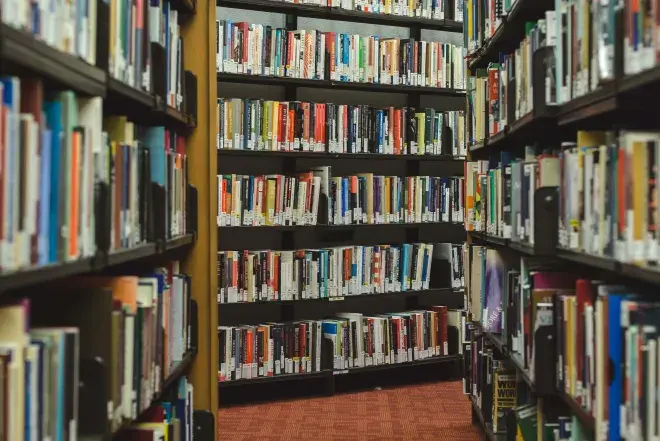 A library aisle full of books