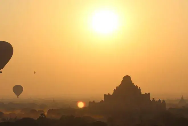 Sunrise and hot air balloons over Myanmar. 