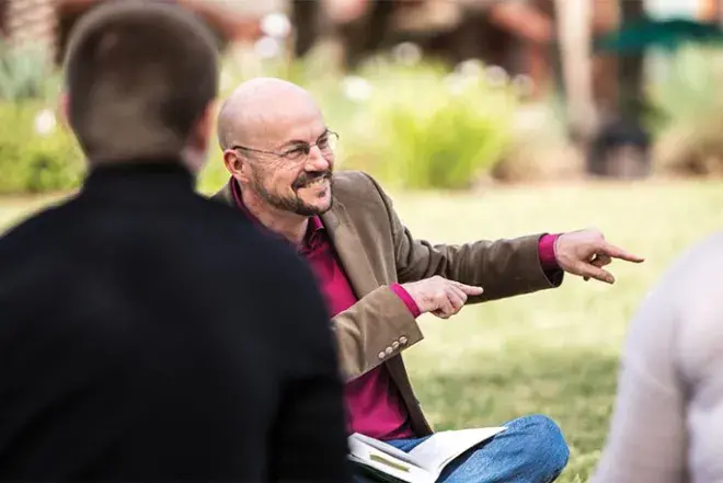 Professor Doug Keaton teaching students on the West Lawn