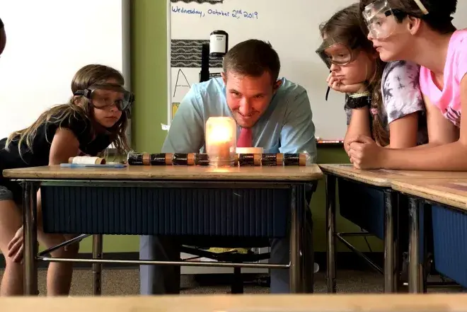 Deaf Education educator.jpeg Anthony Coy-Gonzalez working with students on a science experiment.