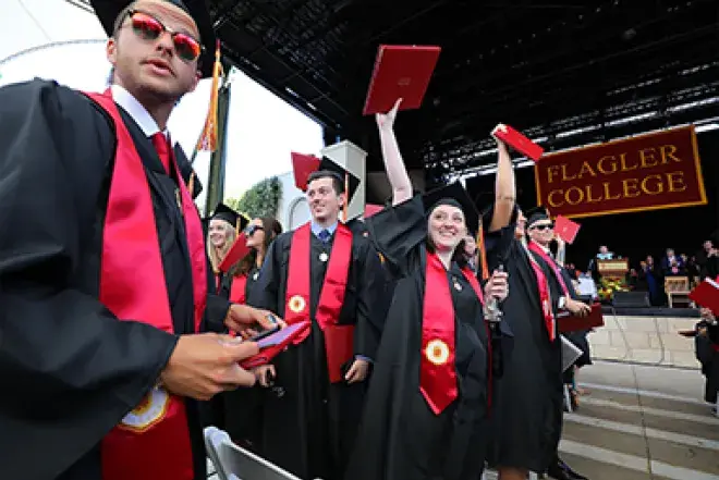 Students throwing their caps at graduation.