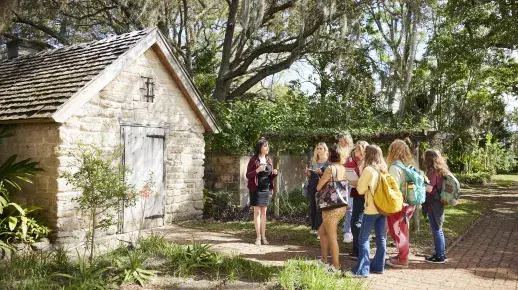 A group of students learns outside in historic downtown St. Augustine.