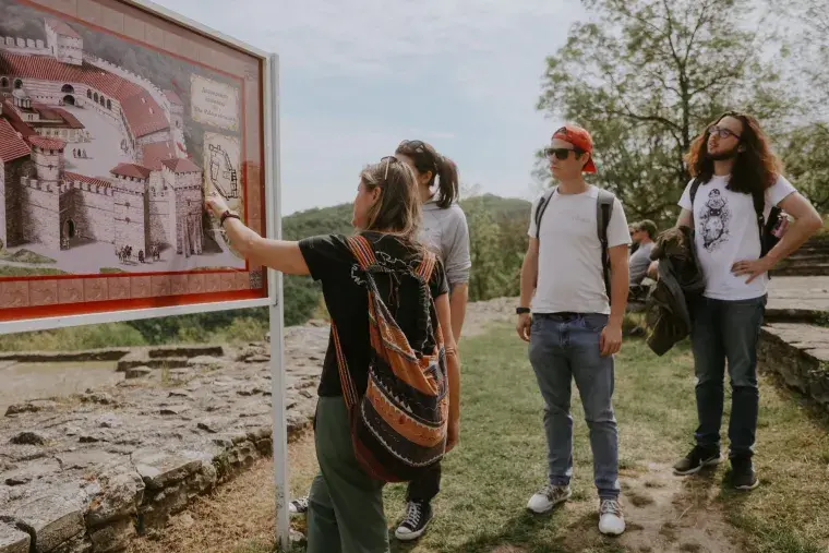 A Flagler College student group look at a sign on an overseas trip.