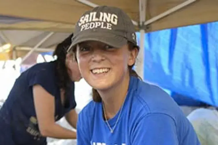 A student smiles.