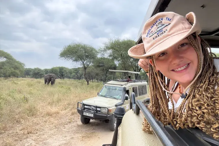 Nateleigh Nachreiner on Safari in Tanzania - head out the window of jeep