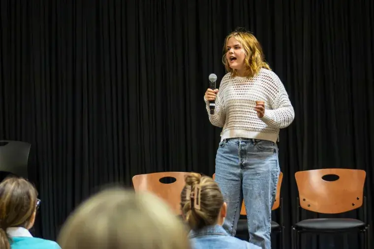Alexandra (Ally) Olejniczak giving her speech during the annual COM Week Speech Competition