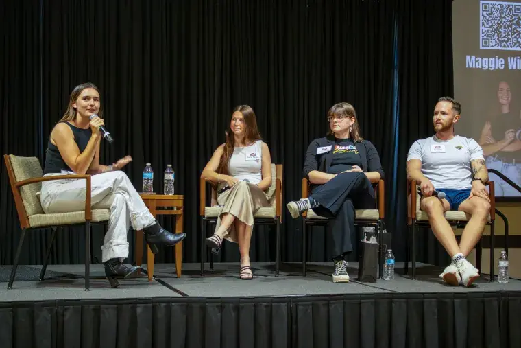 Maggie Windle asking the panel a question