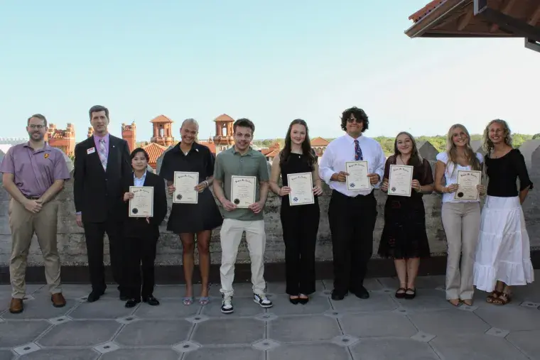 the eleven students who make up the inaugural Kappa Mu Epsilon academic society