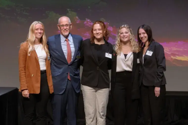 Image of students and faculty at Business Week