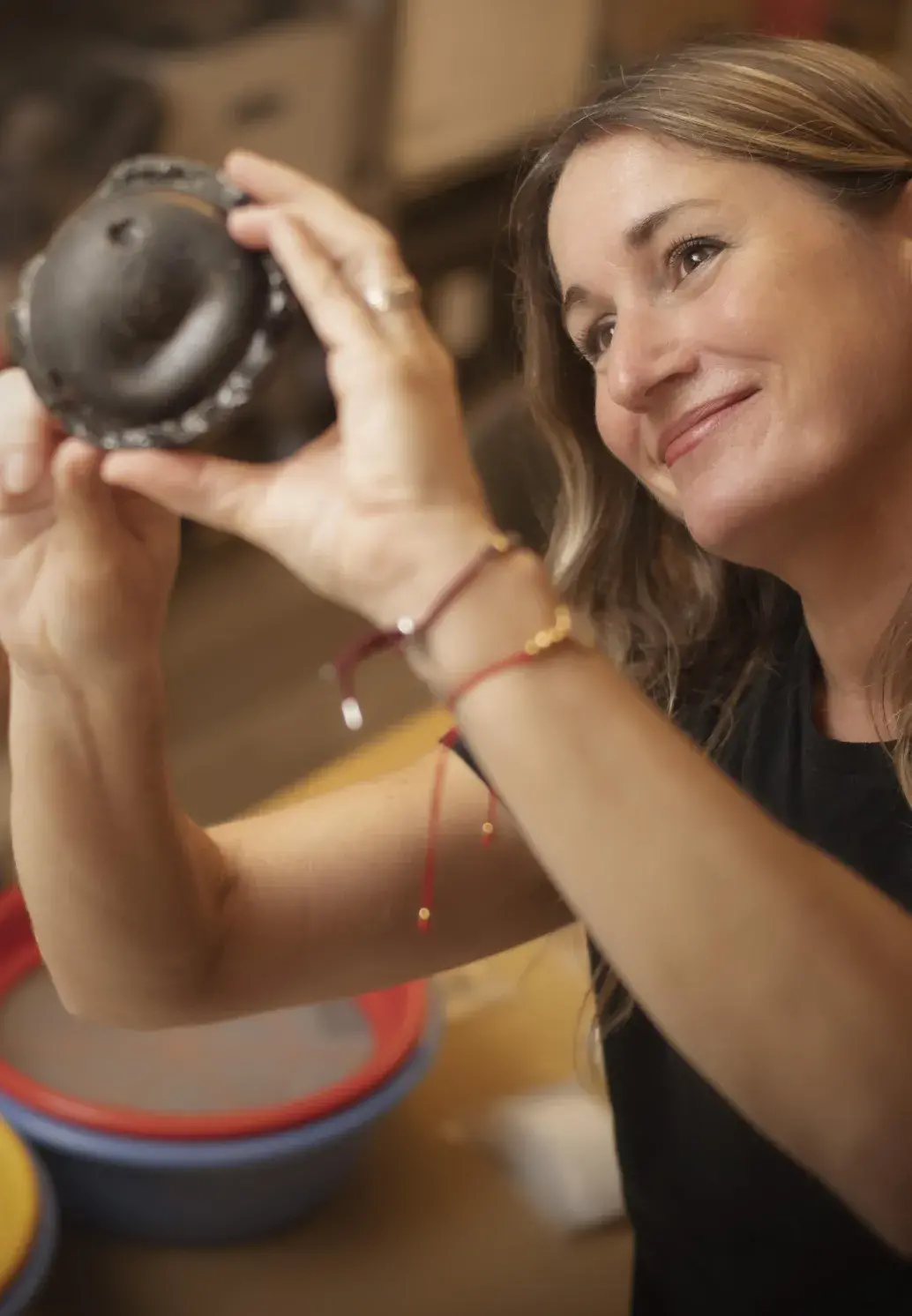 A Flagler College archaeology student examines a piece of pottery.