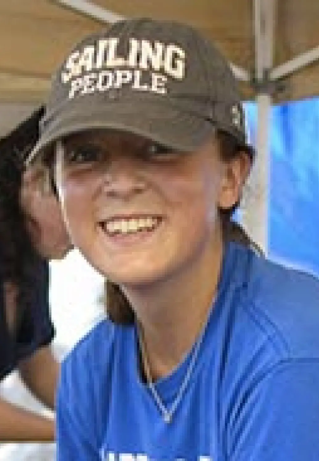 A student smiles.