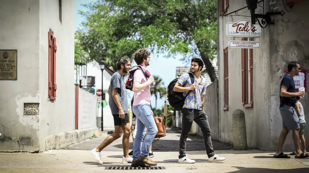 Students walking with friends down St. George Street 