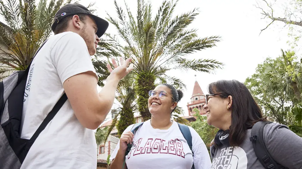 Students talking in the palm garden