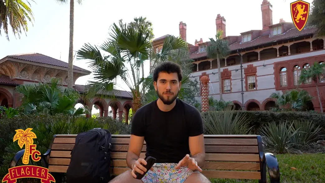 Student sitting by the fountain in the Ponce courtyard