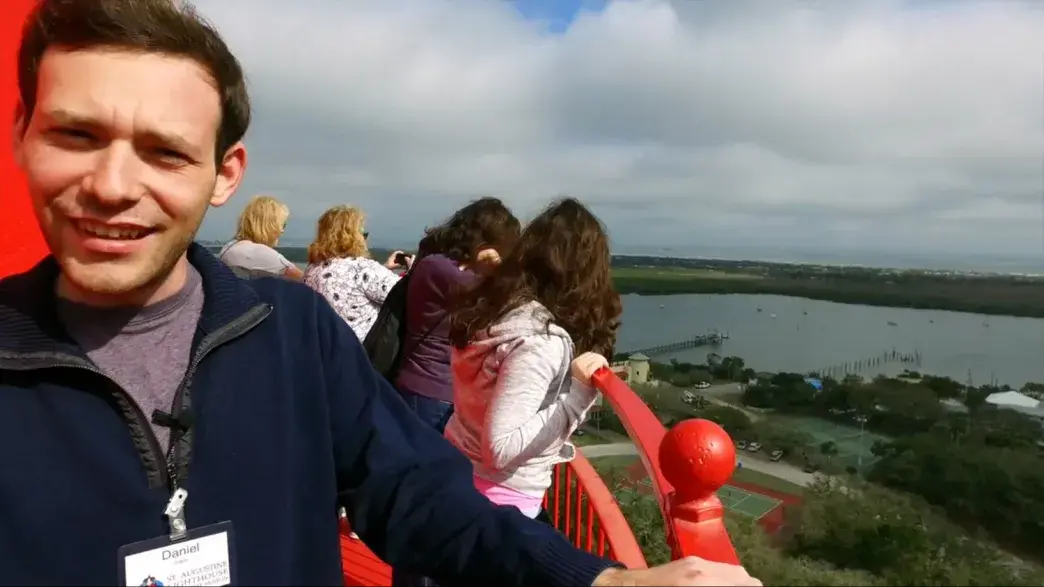 A Flagler College student atop the St. Augustine Lighthouse.