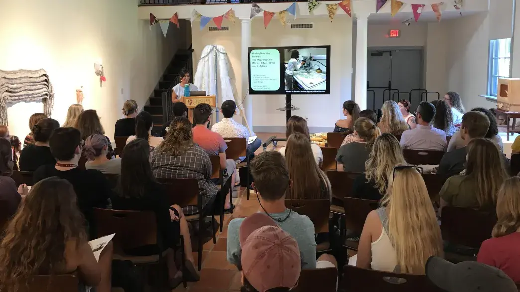 Flagler College students attend a talk at Crisp Ellert Art Museum