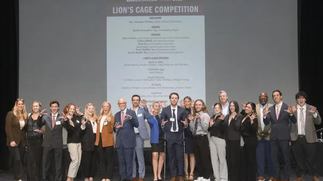 Photo of students and faculty at Lion's Cage competition