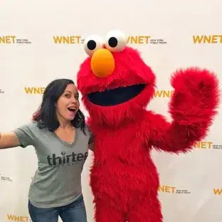 Amanita Bessette posing with Elmo