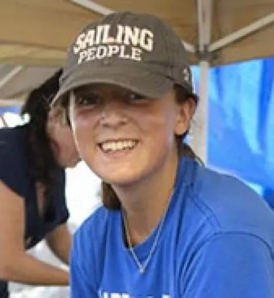 A student smiles.