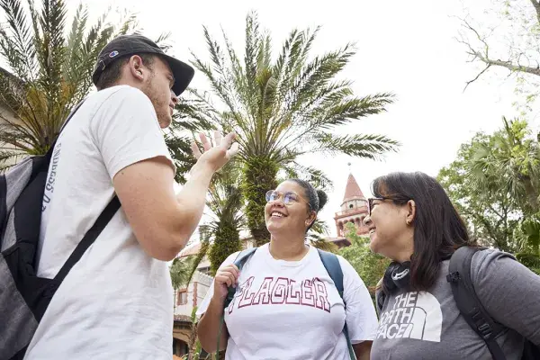 Students talking in the palm garden