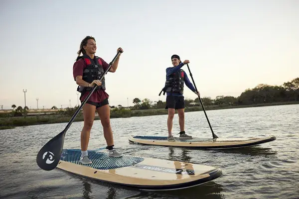 Students paddleboarding