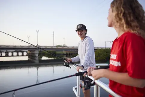 Students fishing at the dock