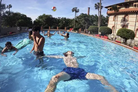 Flagler College students relax and play in one of two pools.