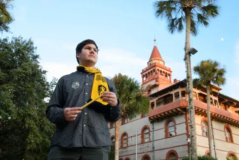 A Flagler College student holds a wand during Harry Potter week.