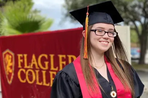 A Flagler College Tallahassee graduate is shown.