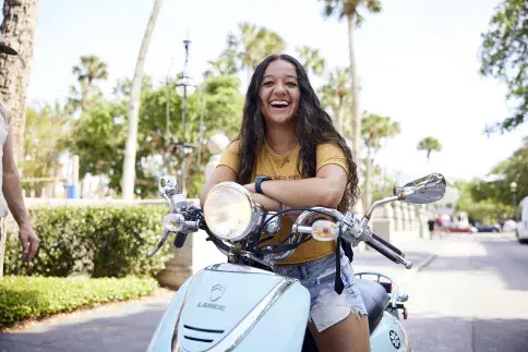 A student on a motorcycle