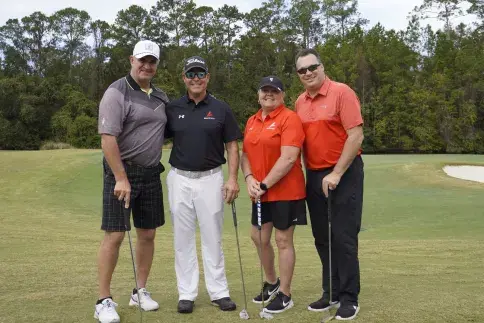 Group of golfers posing for the camera