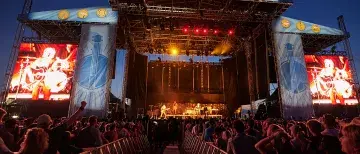 Audience view of the Sing Out Loud main stage at night time.