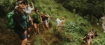 Students walking through hills in Tanzania