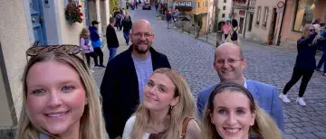 Three female students in Wurzburg Germany with two males