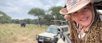 Nateleigh Nachreiner on Safari in Tanzania - head out the window of jeep