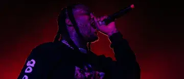 Waka Flocka rapping into the mic at Flagler Fest